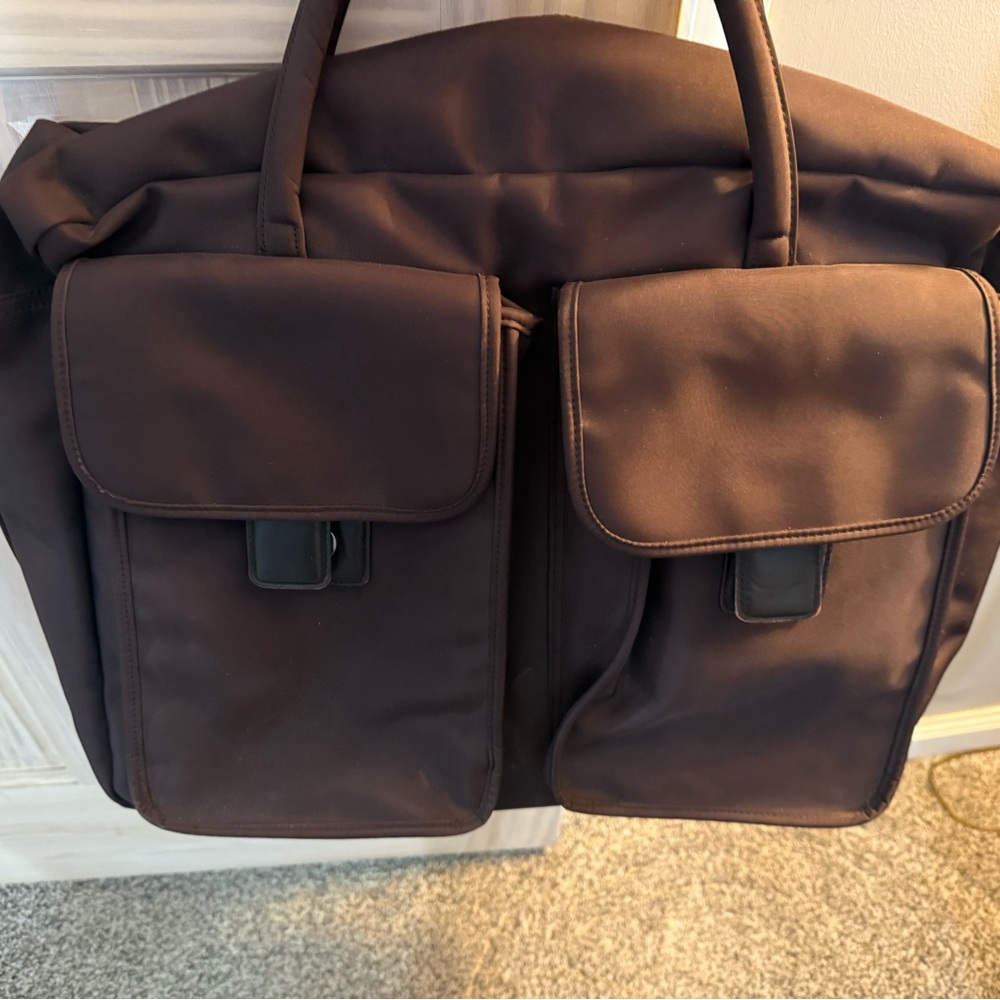 Brown Handbag with Silver Accents. Used for overnights and work bag.